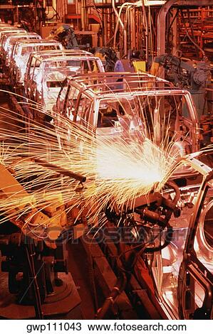 Robots weld van bodies at GM plant, Baltimore, Maryland View Large Photo Image Stock Image - Robots weld van bodies at GM plant, Baltimore, Maryland. Fotosearch