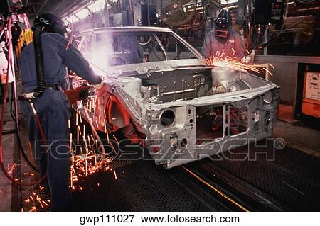 Workers weld car bodies, Chrysler plant, Newark, Delaware View Large Photo Image Stock Photo - Workers weld car bodies, Chrysler plant, Newark, Delaware. Fotosearch
