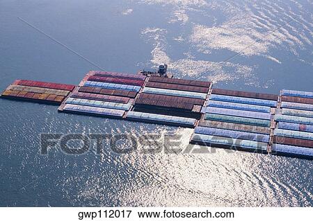 Stock Photo - Barge traffic on the Mississippi Rive, New Orleans. Fotosearch