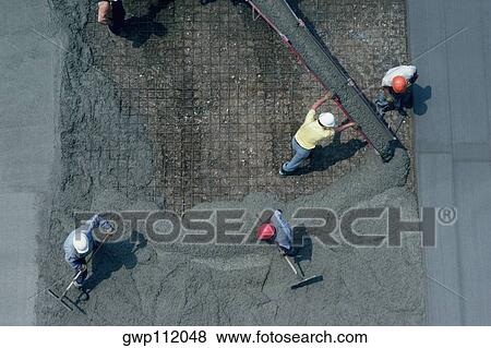 Laying cement for road construction View Large Photo Image Stock Photo - Laying cement for road construction. Fotosearch