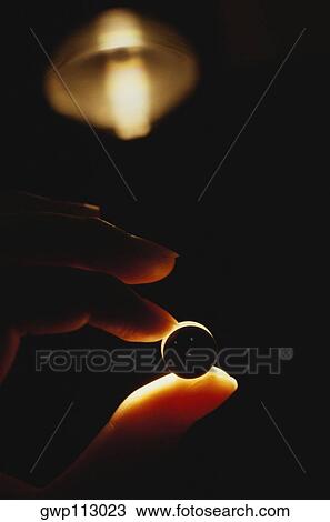 Close-up of a person's fingers holding a microscope lens, Tokyo prefecture, Japan View Large Photo Image Stock Image - Close-up of a person's fingers holding a microscope lens, Tokyo prefecture, Japan. Fotosearch