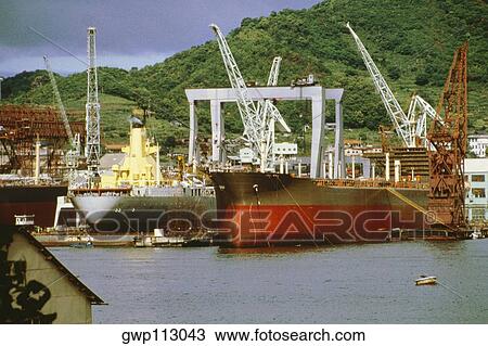 Container ships in a shipyard, Nagasaki, Japan View Large Photo Image Stock Image - Container ships in a shipyard, Nagasaki, Japan. Fotosearch