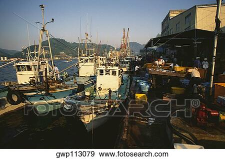 Fishing boats moored at a port, Uwajima, Ehime, Shikoku island, Japan View Large Photo Image Stock Photo - Fishing boats moored at a port, Uwajima, Ehime, Shikoku island, Japan. Fotosearch