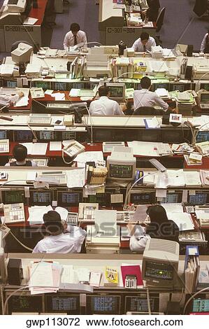 High angle view of a group of people working in a financial company, Tokyo Prefecture, Japan View Large Photo Image Stock Image - High angle view of a group of people working in a financial company, Tokyo Prefecture, Japan. Fotosearch