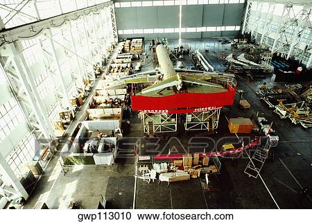 Stock Image - High angle view of a passenger craft in an airplane factory, Shanghai, China. Fotosearch