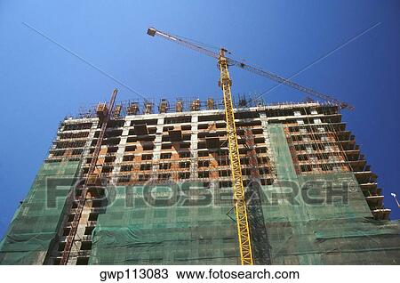 Low angle view of a building under construction, Yangon, Myanmar View Large Photo Image Stock Image - Low angle view of a building under construction, Yangon, Myanmar. Fotosearch