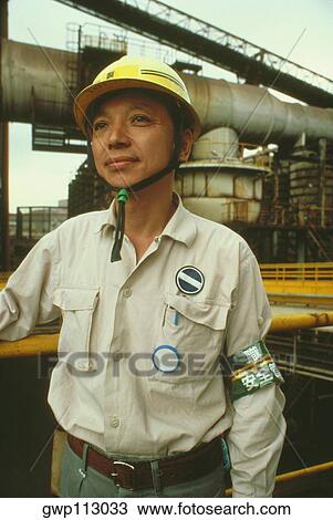 Stock Image - Male foreman at steel industry, Kawasaki, Honshu, Japan. Fotosearch