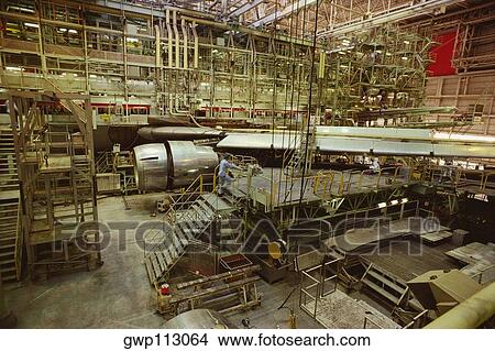 Male mechanic repairing a jet aircraft, Tokyo International Airport, Tokyo Prefecture, Japan View Large Photo Image Picture - Male mechanic repairing a jet aircraft, Tokyo International Airport, Tokyo Prefecture, Japan. Fotosearch