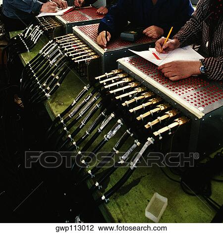 Mid section view of production line workers working in an airplane factory, Shanghai, China View Large Photo Image Stock Image - Mid section view of production line workers working in an airplane factory, Shanghai, China. Fotosearch