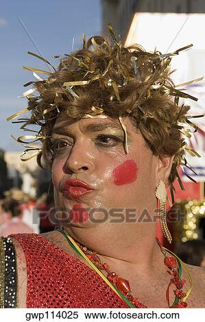 Close-up of a mature man wearing a costume and puckering his lips View Large Photo Image Stock Photography - Close-up of a mature man wearing a costume and puckering his lips. Fotosearch