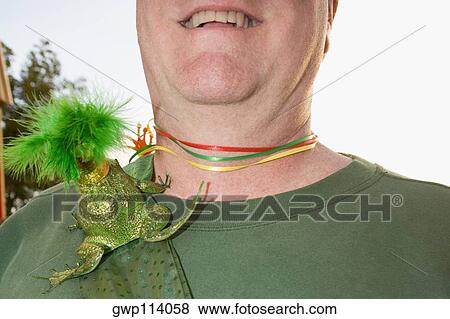 Close-up of a toy frog on a man's shoulder View Large Photo Image Stock Photo - Close-up of a toy frog on a man's shoulder. Fotosearch