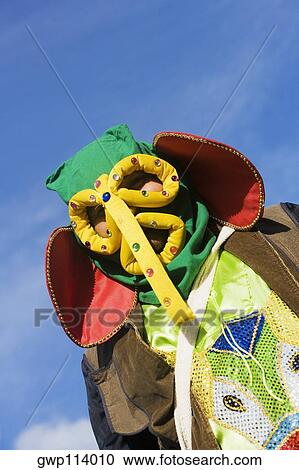 Stock Image - Low angle view of a man wearing a costume. Fotosearch