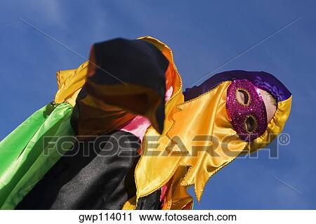 Stock Image - Low angle view of a man wearing a costume. Fotosearch