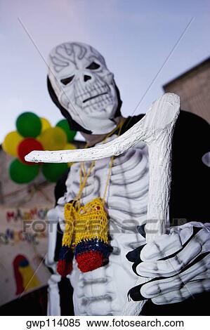 Low angle view of a man wearing a costume and a mask View Large Photo Image Stock Photography - Low angle view of a man wearing a costume and a mask. Fotosearch