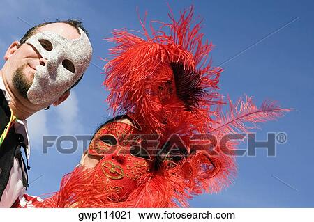 Low angle view of a man with a woman wearing costumes View Large Photo Image Stock Image - Low angle view of a man with a woman wearing costumes. Fotosearch