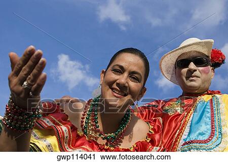 Low angle view of a mature couple wearing costumes and smiling View Large Photo Image Stock Image - Low angle view of a mature couple wearing costumes and smiling. Fotosearch