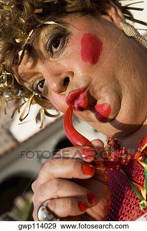 Low angle view of a mature man puckering his lips View Large Photo Image Stock Photo - Low angle view of a mature man puckering his lips. Fotosearch