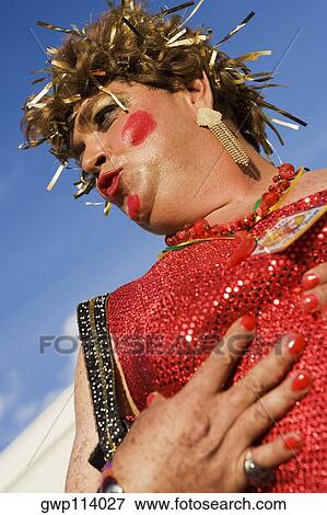 Low angle view of a mature man wearing a costume and puckering his lips View Large Photo Image Stock Photo - Low angle view of a mature man wearing a costume and puckering his lips. Fotosearch