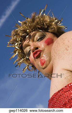 Low angle view of a mature man wearing a costume and puckering his lips View Large Photo Image Stock Photograph - Low angle view of a mature man wearing a costume and puckering his lips. Fotosearch
