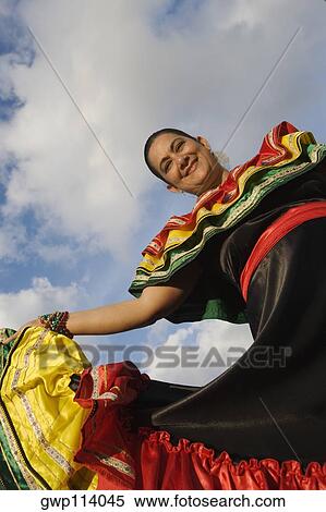 Low angle view of a mature woman wearing a costume and dancing View Large Photo Image Stock Photography - Low angle view of a mature woman wearing a costume and dancing. Fotosearch