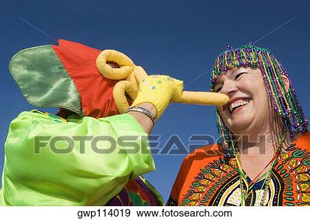 Low angle view of a senior woman wearing beaded headdress and looking at an another woman View Large Photo Image Stock Photo - Low angle view of a senior woman wearing beaded headdress and looking at an another woman. Fotosearch