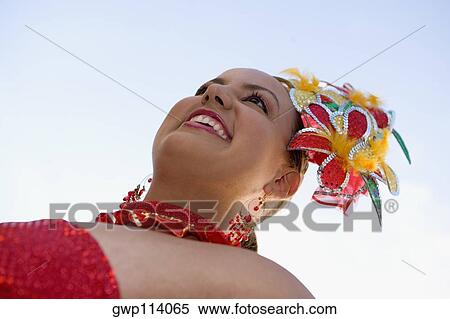 Low angle view of a teenage girl wearing a costume in a traditional festival View Large Photo Image Stock Photography - Low angle view of a teenage girl wearing a costume in a traditional festival. Fotosearch