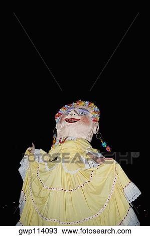 Low angle view of a woman wearing a mask View Large Photo Image Stock Image - Low angle view of a woman wearing a mask. Fotosearch