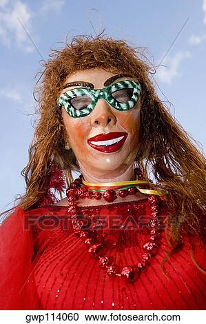 Low angle view of a woman wearing a carnival mask View Large Photo Image Stock Image - Low angle view of a woman wearing a carnival mask. Fotosearch