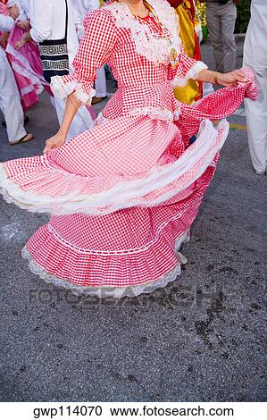Stock Image - Low section view of a woman wearing a costume and dancing. Fotosearch