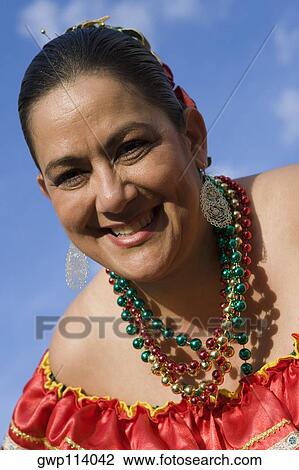 Portrait of a mature woman smiling View Large Photo Image Stock Image - Portrait of a mature woman smiling. Fotosearch