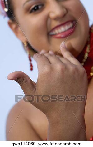 Portrait of a teenage girl smiling and gesturing View Large Photo Image Stock Photo - Portrait of a teenage girl smiling and gesturing. Fotosearch