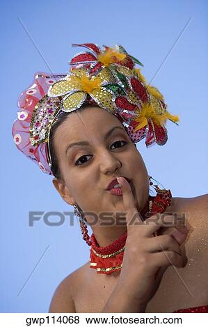 Portrait of a teenage girl with her finger on her lips View Large Photo Image Stock Photo - Portrait of a teenage girl with her finger on her lips. Fotosearch