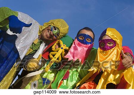 Portrait of three men with a woman showing a thumbs up sign View Large Photo Image Stock Photo - Portrait of three men with a woman showing a thumbs up sign. Fotosearch