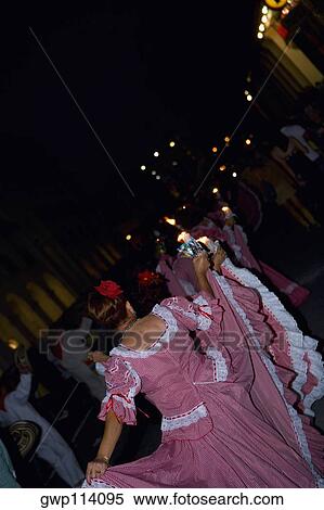 Rear view of a woman dancing in a traditional festival View Large Photo Image Stock Photography - Rear view of a woman dancing in a traditional festival. Fotosearch