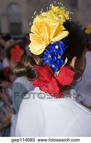 Rear view of a woman wearing flowers View Large Photo Image Stock Image - Rear view of a woman wearing flowers. Fotosearch