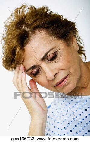 Close-up of a senior woman suffering from a headache View Large Photo Image Stock Image - Close-up of a senior woman suffering from a headache. Fotosearch