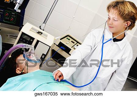 Boy imitating a doctor and examining a patient with a stethoscope View Large Photo Image Stock Photography - Boy imitating a doctor and examining a patient with a stethoscope. Fotosearch