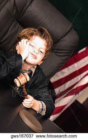 Stock Photo - Boy imitating a judge. Fotosearch