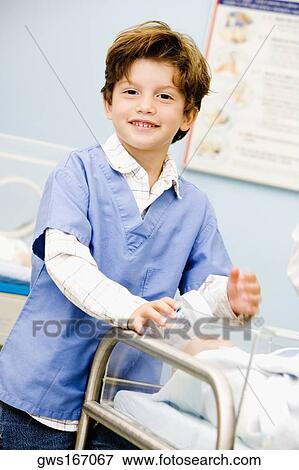 Portrait of a boy holding a baby bottle View Large Photo Image Stock Photo - Portrait of a boy holding a baby bottle. Fotosearch