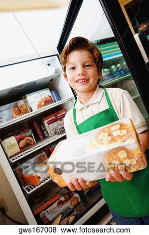 Portrait of a boy holding a box of waffles View Large Photo Image Stock Photo - Portrait of a boy holding a box of waffles. Fotosearch