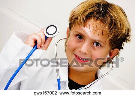 Portrait of a boy holding a stethoscope View Large Photo Image Stock Image - Portrait of a boy holding a stethoscope. Fotosearch