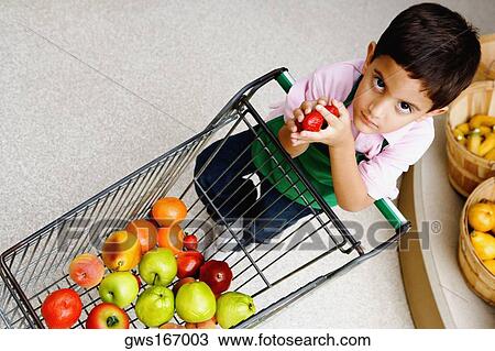 Portrait of a boy holding strawberries View Large Photo Image Stock Image - Portrait of a boy holding strawberries. Fotosearch