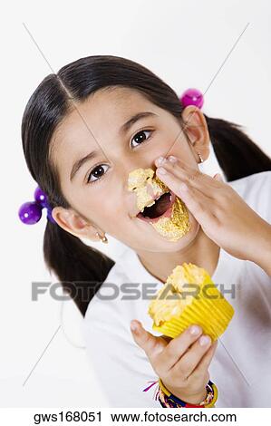 Stock Image - Portrait of a girl with cream on her face. Fotosearch