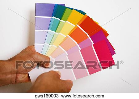 Close-up of a person's hands holding color swatches View Large Photo Image Stock Image - Close-up of a person's hands holding color swatches. Fotosearch