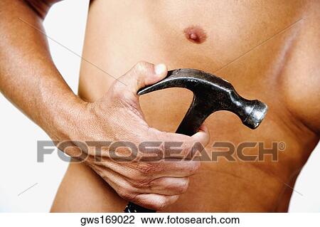 Mid section view of a man holding a claw hammer View Large Photo Image Stock Image - Mid section view of a man holding a claw hammer. Fotosearch