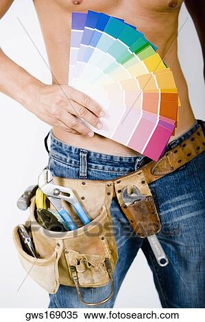 Mid section view of a man holding color swatches View Large Photo Image Stock Photography - Mid section view of a man holding color swatches. Fotosearch