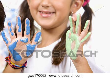 Close-up of a girl showing her painted palms View Large Photo Image Stock Image - Close-up of a girl showing her painted palms. Fotosearch