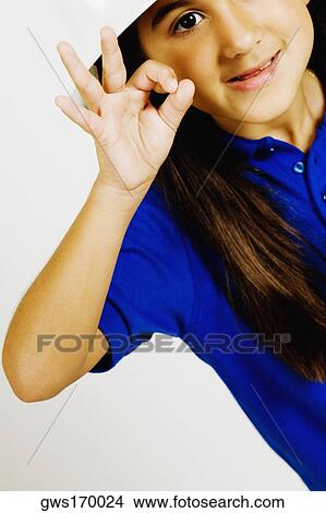 Portrait of a girl making an OK sign View Large Photo Image Picture - Portrait of a girl making an OK sign. Fotosearch