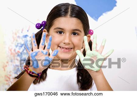 Portrait of a girl showing paint on her palms with her father smiling View Large Photo Image Stock Photograph - Portrait of a girl showing paint on her palms with her father smiling. Fotosearch