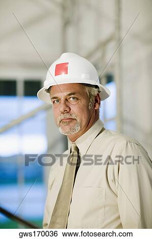Stock Photograph - Portrait of a male architect looking confident. Fotosearch